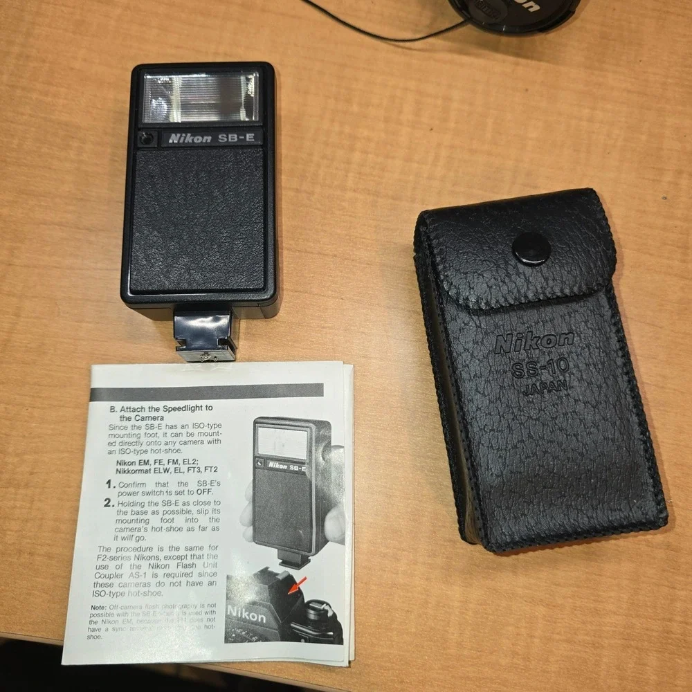 Nikon‎ EM 35mm Camera body lens series e flash cases for camera manuals timer